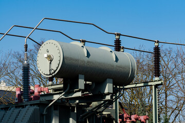 Fototapeta premium Power transformer against a clear blue sky on a sunny day