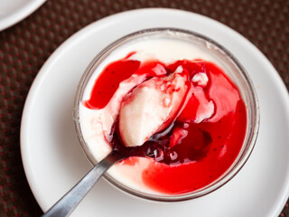Vegan Panna cotta with cranberry sauce. Healthy vegan dessert