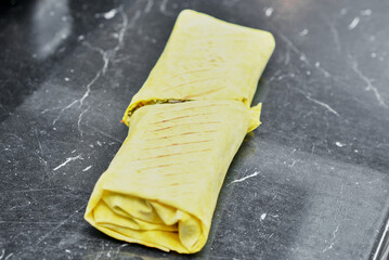 Fresh yellow shawarma cut in half