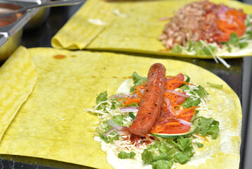 Preparing grilled sausage kebab