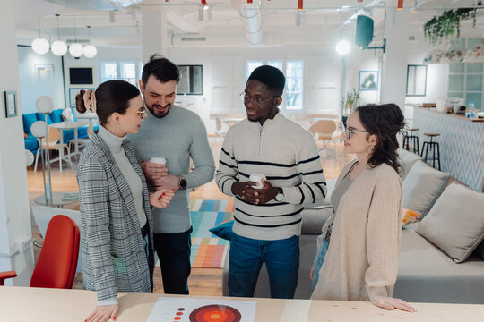 Marketing professionals discussing strategy in modern office