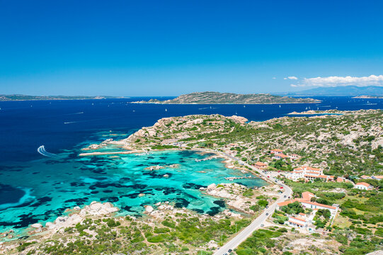Turquoise waters and rugged coastline seen from above Punta Tegge, La Maddalena Island. Sardinia, Italy