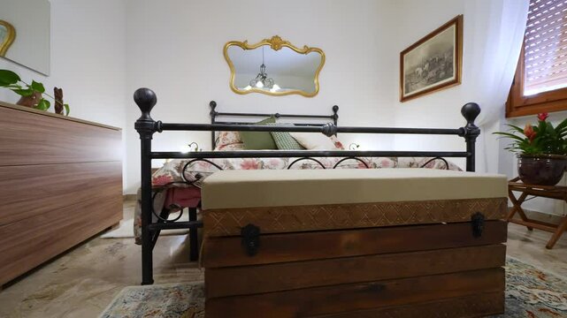 Charming old-style bedroom featuring a luxurious bed and rustic furniture