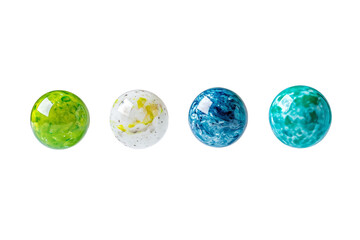 Four different colored glass balls are lined up on a white background, isolated