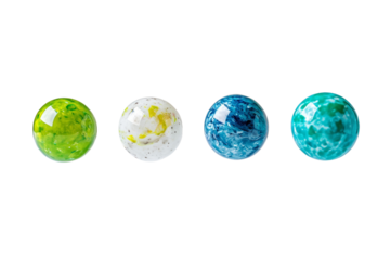 Four different colored glass balls are lined up on a white background, isolated