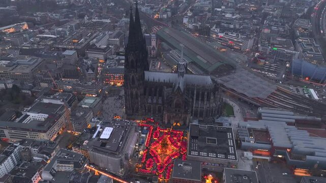 Christmas market near to Cologne Cathedral, evening Weihnachtsmarkt, Koelner Dom in Cologne, Germany, Aerial Winter Shot