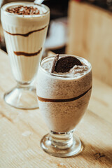 photo of black cookie milkshake and chocolate milkshake in the background at Colombian coffee shop