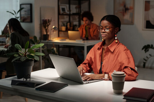 Gen Z Black Woman Working in Modern Office