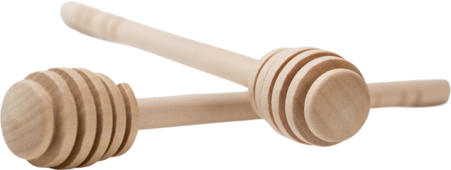 Wooden sticks for honey on a white background