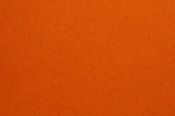 The orange background is a solid color with no pattern, textured origami paper backdrop