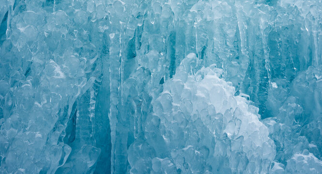 Cold winter icicles melting banner. Blue frozen ice close-up photograph. 	