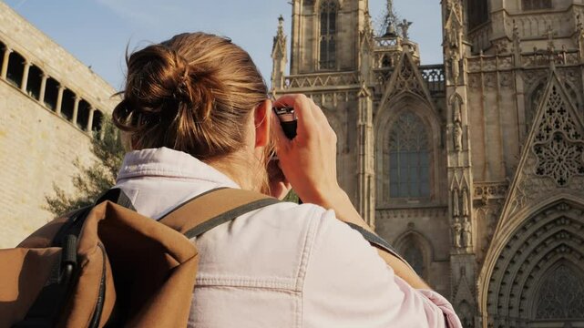 Happy tourist man in Barcelona, Spain. Vacation exploring interesting places to travel, student vacation, young man portrait walking in gothic square, old european city. 