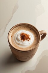 Warm Coffee Latte with Whipped Cream and Cinnamon Spice in Mug