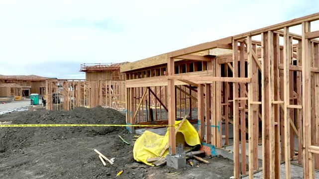 Crane Movement Aerial Drone Flight Over Home Construction Site.