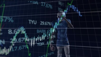 Football player holding ball over financial stock market graph animation - Powered by Adobe