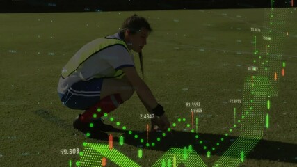 Soccer player kneeling on field with financial data animation overlay - Powered by Adobe