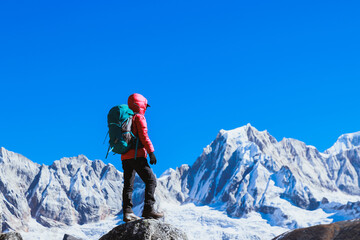Successful woman hiker on high altitude mountain top