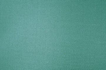 緑色の詰まった生地のパターン