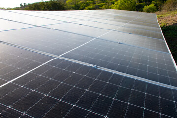 Open space solar panels installation with photovoltaic modules on a hay field in rural farm on...