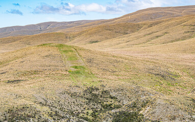Fototapeta premium Oteake conservation area otago new zealand hills velvety beautiful landscapes dry yellow brown grass bare land