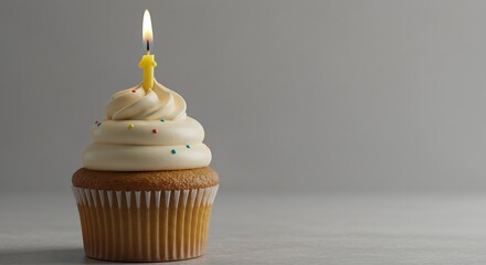 Celebrating with Cupcake Lit Candle and Festive Sprinkles on Table