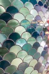 Interior decoration materials: fish scale stone walls, reflective green terracotta tiles © oselote