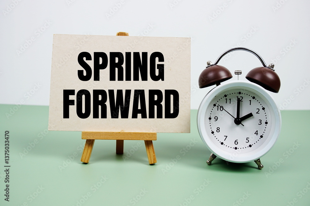 Poster spring forward text on paper card with alarm clock on green background