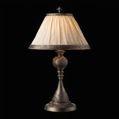 Elegant and sophisticated table lamp with unique design, dark metal base, gold finish, curved top, and ornate details.