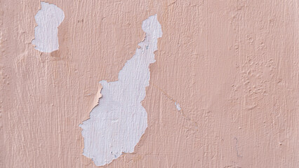 A weathered surface with cracked and peeling paint, showcasing an abstract pattern