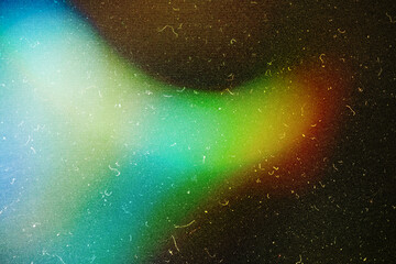 grainy colorful warm blue light leaks on black background with dust texture abstract damaged...