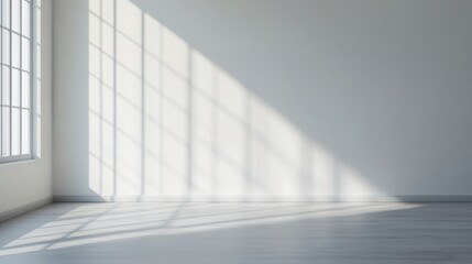 Fototapeta premium Minimalist interior design neutral tones space planning. Bright, empty room with sunlight casting geometric shadows on the floor.