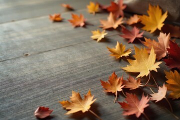 Autumnal foliage scattered on rustic wood surface showcasing nature's vibrant fall colors