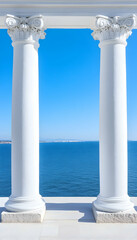 Naklejka premium Two white columns frame a vibrant ocean view under a clear blue sky . AI generative