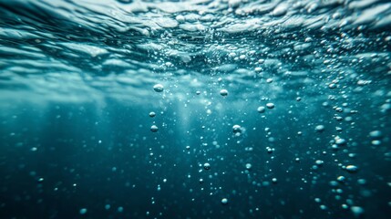 Rising air bubbles in water create a mesmerizing underwater atmosphere