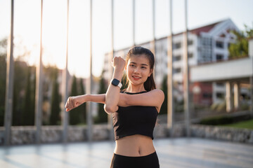 Active healthy asian woman exercising athletes in fitness clothes.sunrise sports girl front of...