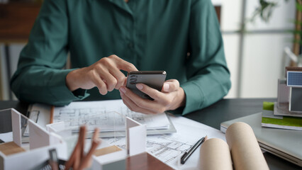Architecture Man use smart phone for architectural Creative project business architecture ecosystem building construction Industrial engineering Design.