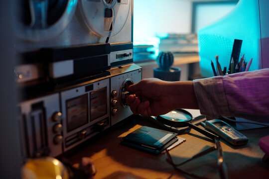 Hand Turning on Vintage Reel-to-Reel Audio Tape Recorder