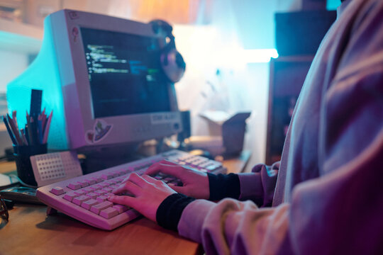 Midsection of Unknown Male Web Developer Writing Code on Retro Computer