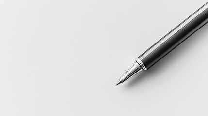 Dark pen, metallic tip, rests on white.