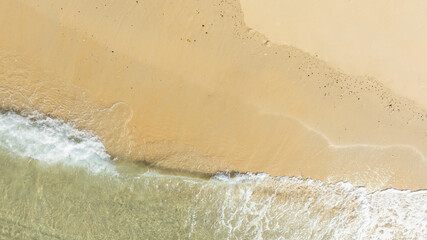 Nature of the beach and sea Summer with sunshine, sandy beaches, clear blue waters sparkling against the blue sky. On an island with good ecology and environment Background for summer vacation