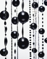 Shiny black fluid metal spheres that flow into innovative shapes and designs, for illustration and abstract art design purposes.