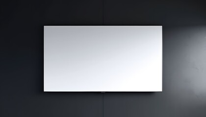 Obraz premium Blank Canvas: A sleek, rectangular frame hangs on a textured, dark wall, illuminated by a soft, focused light that draws attention to the emptiness within.