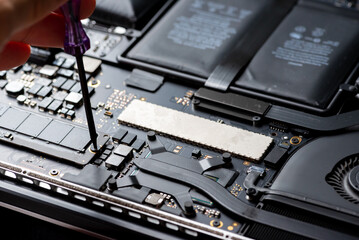 close up of Technician repairing electronic circuit board, repairing, upgrade and technology.