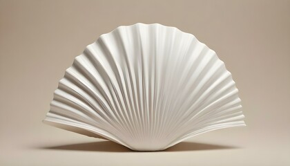 A studio shot of a white scallop shell, showcasing its intricate ribbed texture and fan-like shape, set against a neutral background