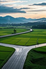 Fototapeta premium arafed view of a road winding through a green field