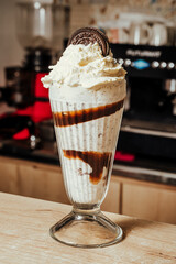 close-up photo of black cookie milkshake in Colombian coffee shop