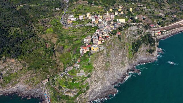 Corniglia village in cinque terre, italy, nestled on cliffs above the sea, aerial view