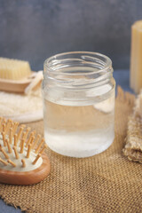 Natural coconut oil displayed on a rustic table setting