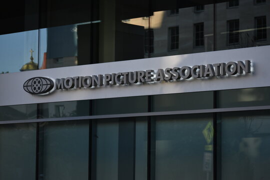 Motion Picture Association of America (MPA) corporate office building entrance with a close-up of the window featuring the official MPA logo