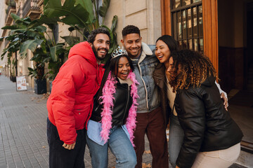 A young Black woman in her late 20s, leading a group of her adult friends through the city street...